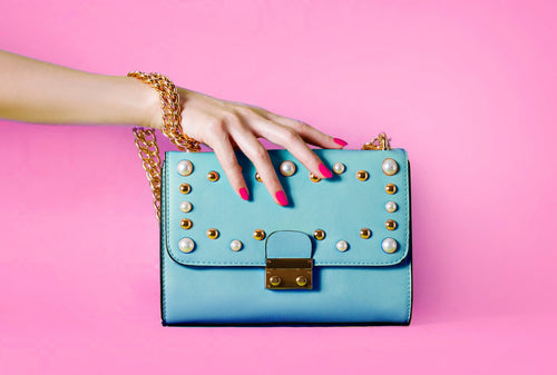 Blue Handbag On Pink Background