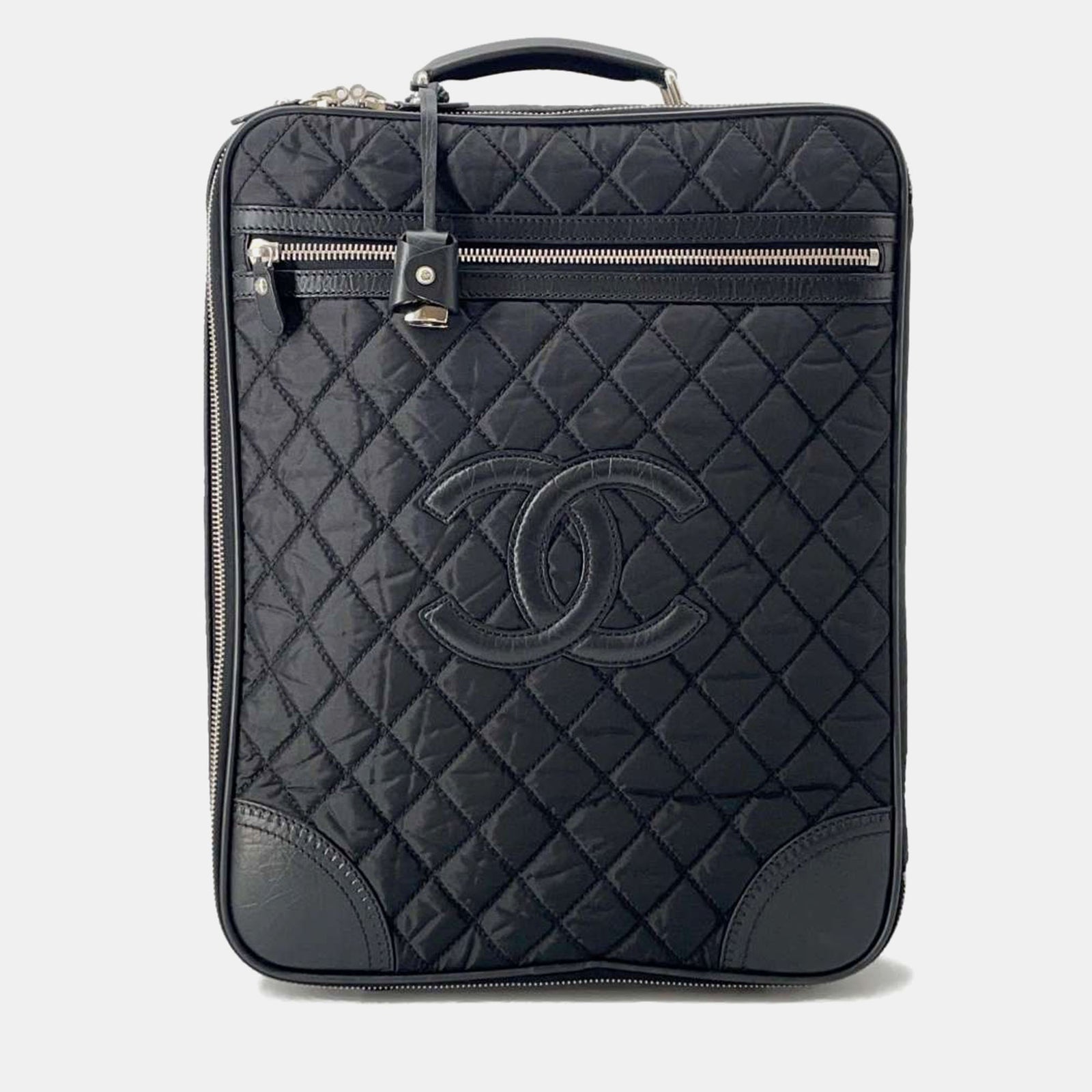 Chanel Sac de transport matelassé en cuir et nylon noir avec logo CC