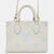 Latte White/Candy Blue Bicolor Monogram Empreinte Leather Onthego PM Bag